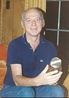 A portrait photo of Rex Inman, former CIMMS Director, smiling at the camera. Photo taken in 1975.