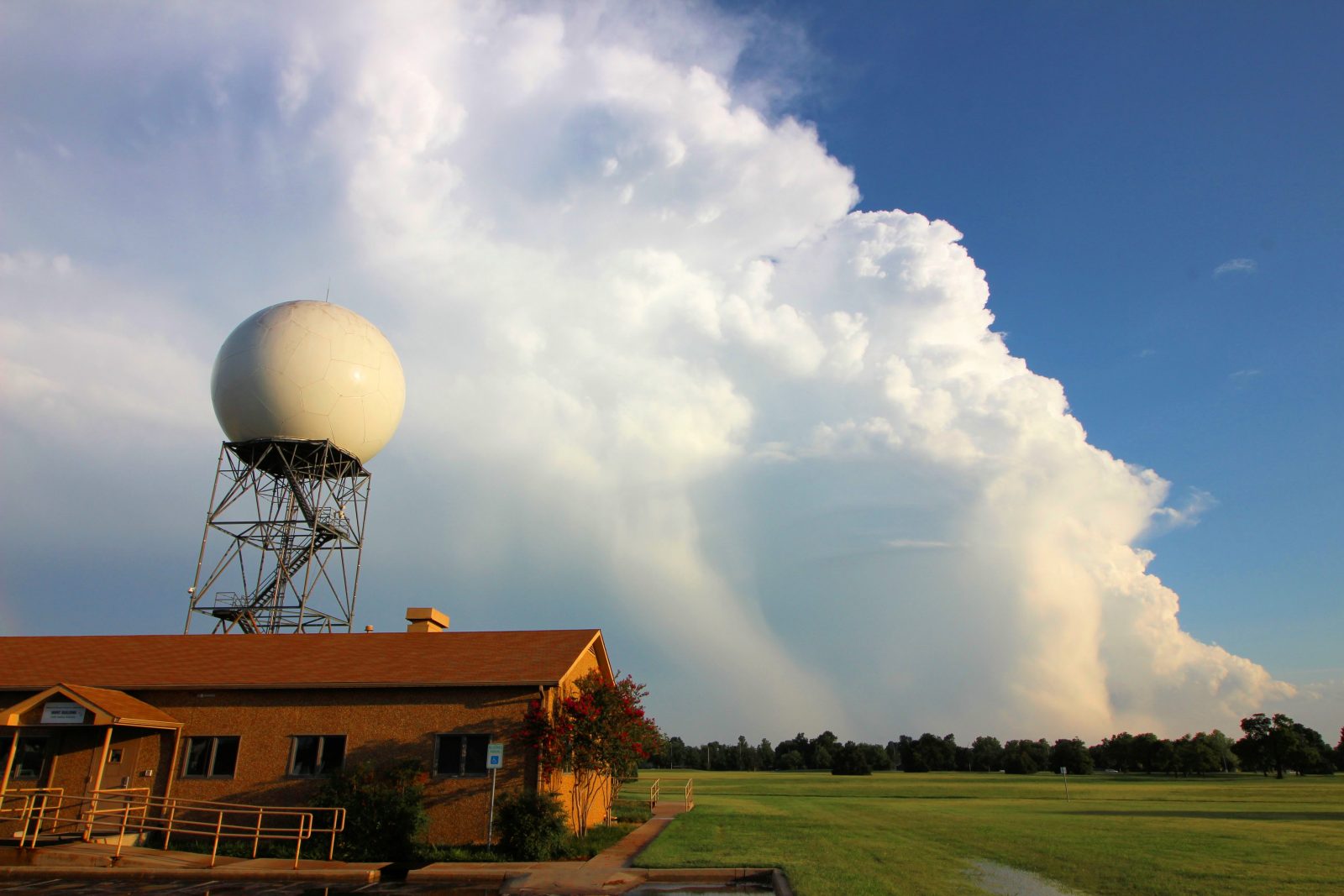 The NOAA National Severe Storms Laboratory research radar collects data on a downburst-producing thunderstorm in Norman, Oklahoma. (Photo by Charles Kuster, OU CIMMS/NSSL) 